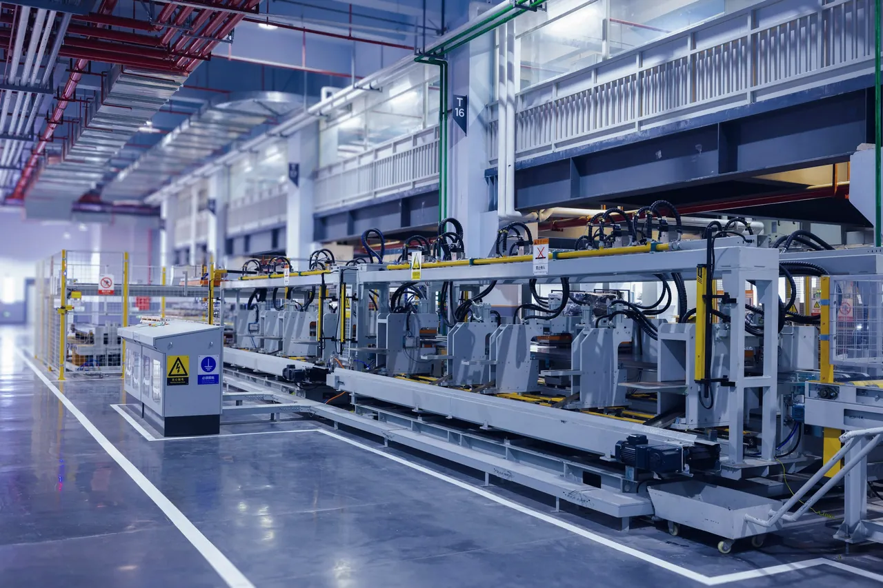 An automated production line running through a large factory hall
